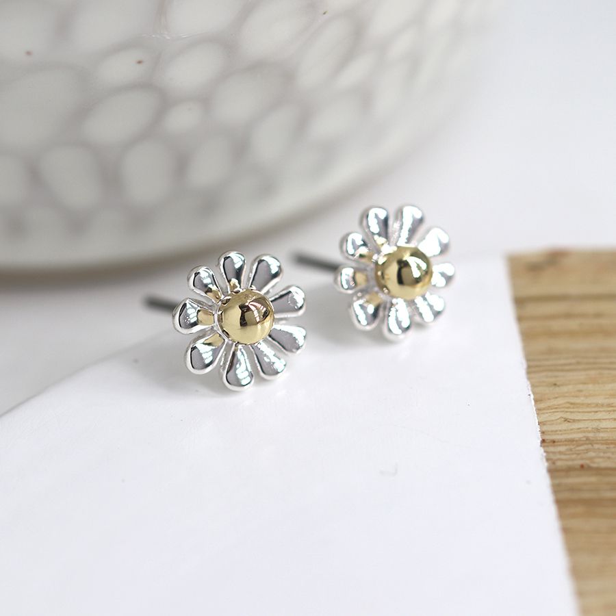 Silver plated and golden daisy stud earrings by Peace of Mind