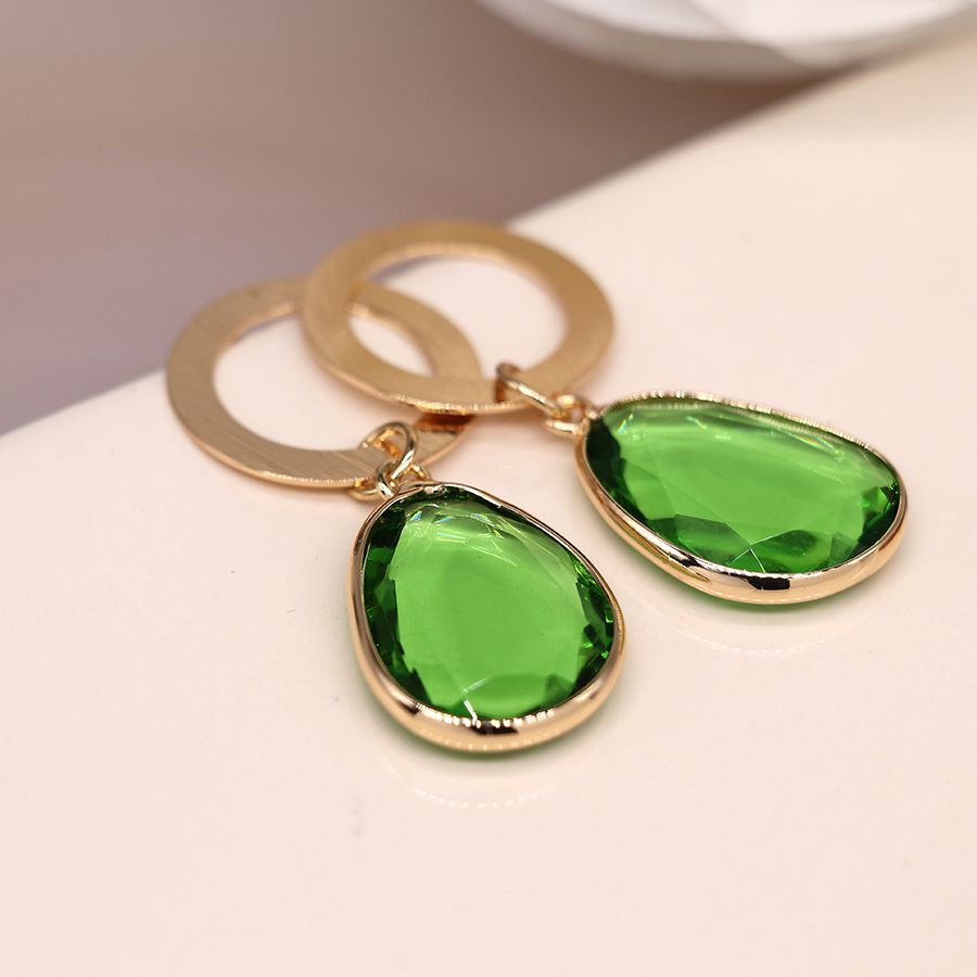 Golden scratched circle and green drop earrings by Peace of Mind