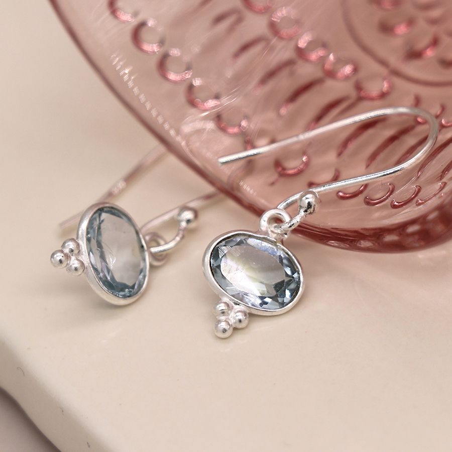 Sterling silver blue topaz oval drop earrings by Peace of Mind